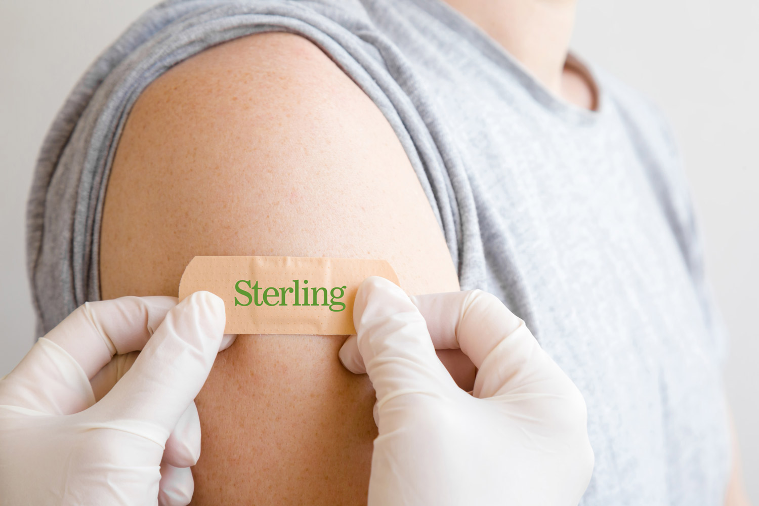 Blue shirt receiving a flu shot